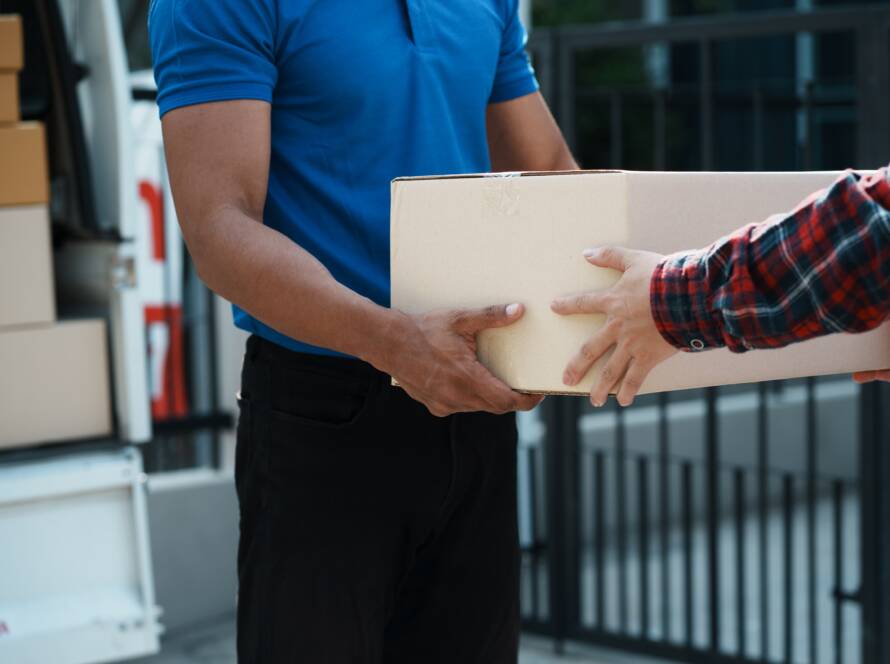 delivery man delivering parcel box to customer whi 2025 01 10 05 39 02 utc 1